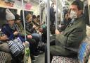 A man on the Underground wearing a protective facemask. Picture: PA