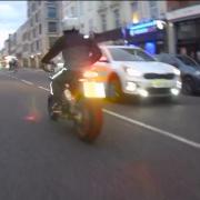 Image of the motorcyclist just before a girl, 9, and three men were shot in Kingsland Road, Dalston