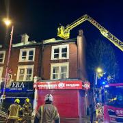 Fire crews used a ladder to help put out the fire