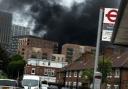 A picture taken near the fire in Canning Town shows thick black smoke rising from the scene
