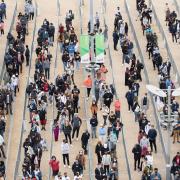 Crowds line up to get their first jab at London Stadium on Saturday, June 19.