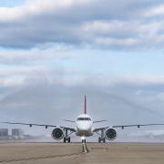 The Helvetic Embraer E190-E2 lands at London City Airport.