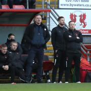 Richie Wellens, Matt Harrold and Paul Terry look on at Brisbane Road